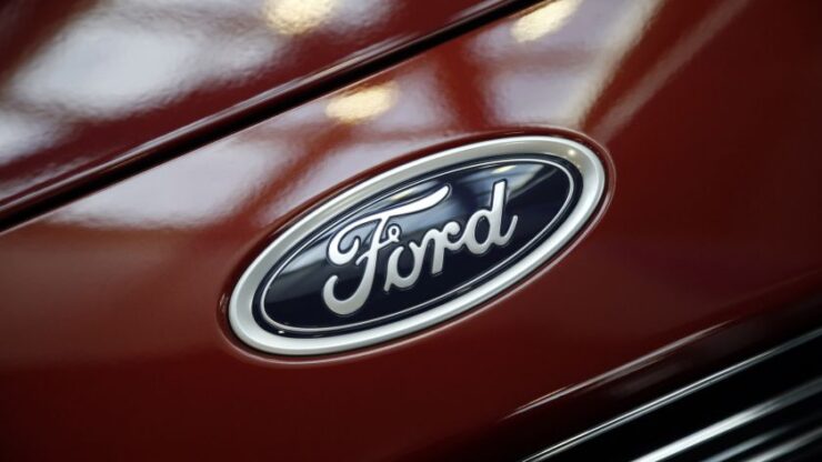 A Ford logo is seen during preparations for the 2014 LA Auto Show in Los Angeles